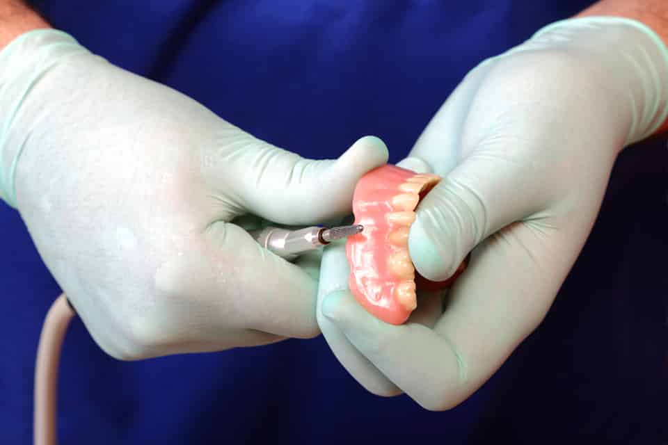 Lab Technician working on Dentures