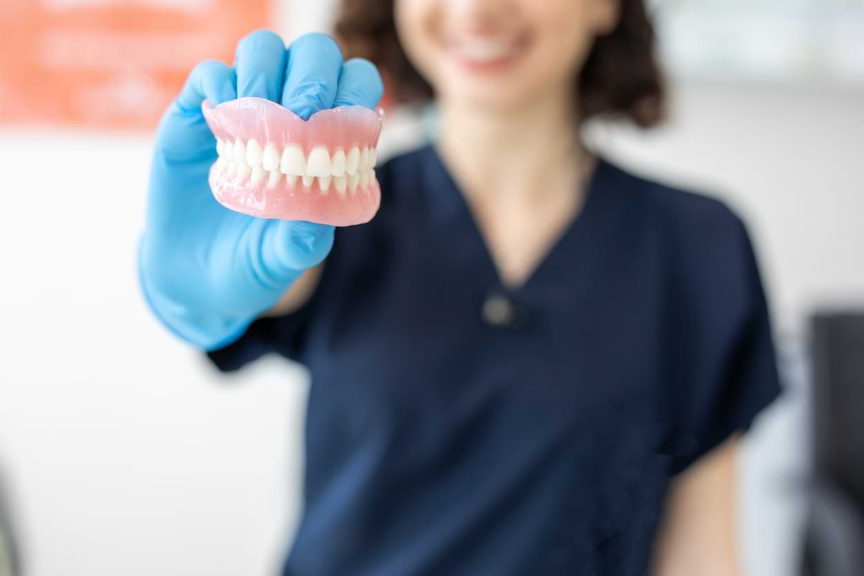 Dentist Showing Dentures