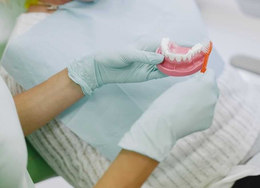 Dentist Cleaning False Teeth